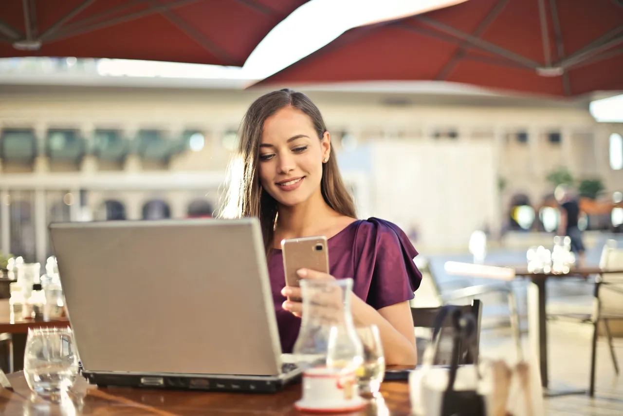 a girl is using her mobile