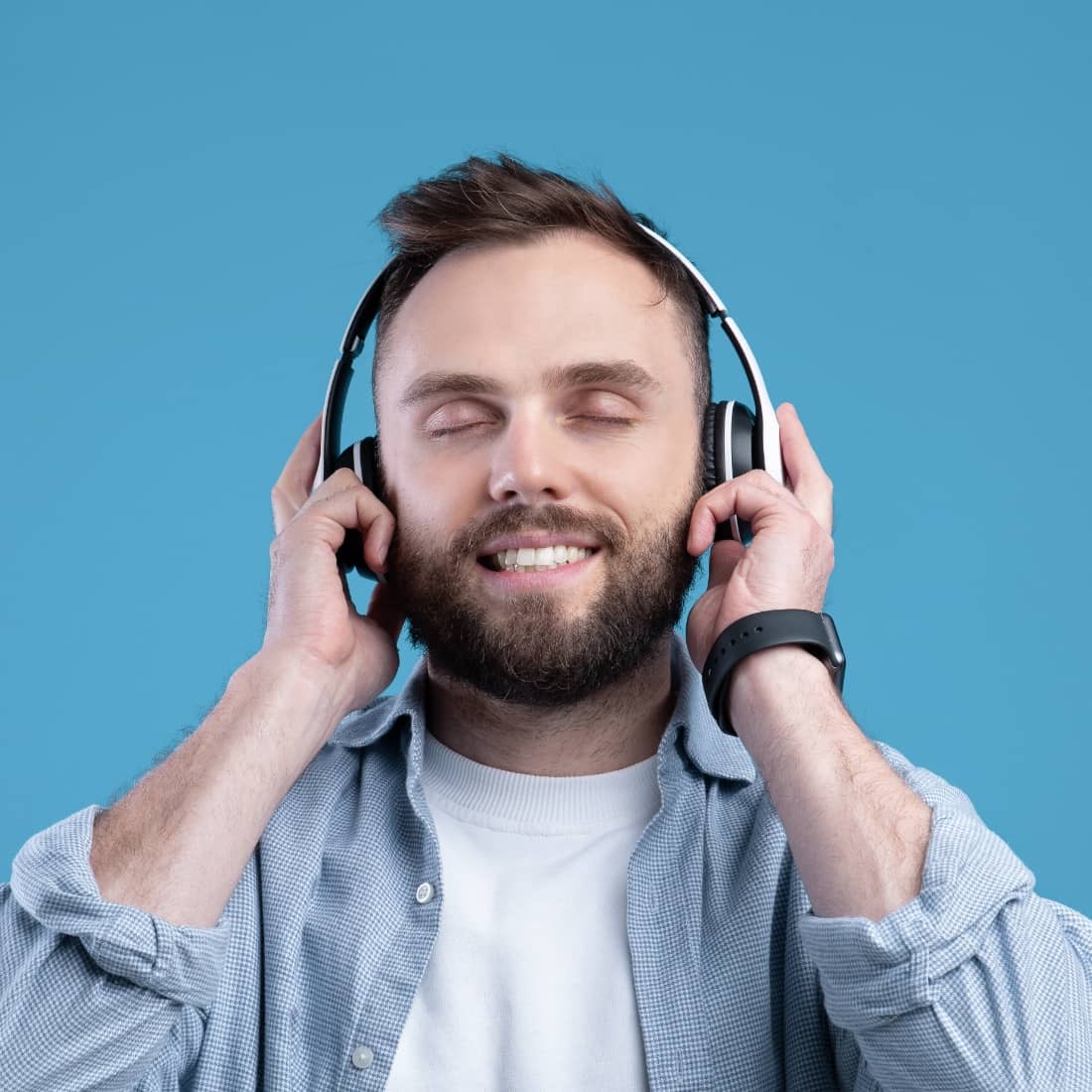 Man is wearing headphone